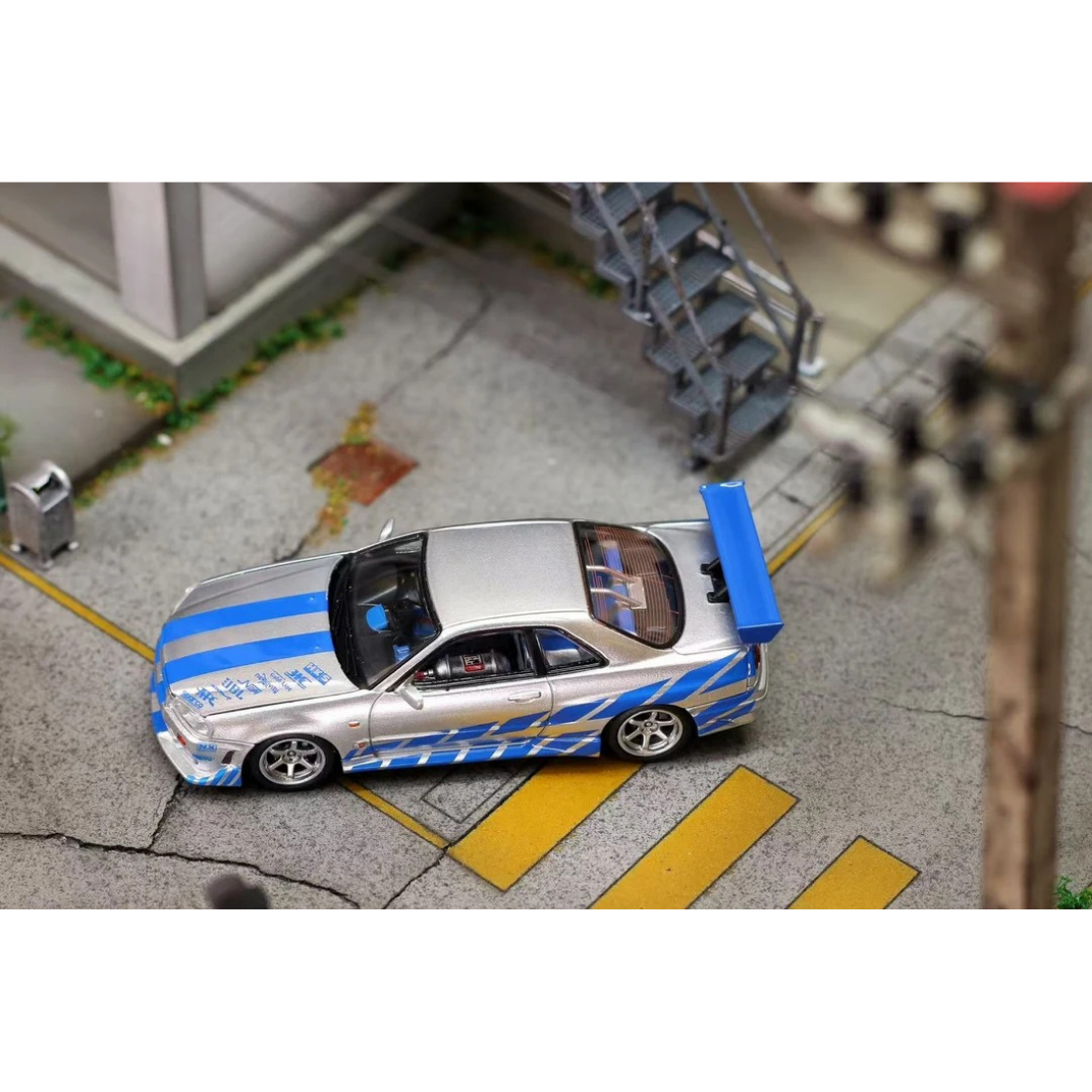 *PRE-ORDER* Nissan Skyline GT-R R34 Silver Blue Livery, 1:64 Scale collectible diecast model at Poketwheels