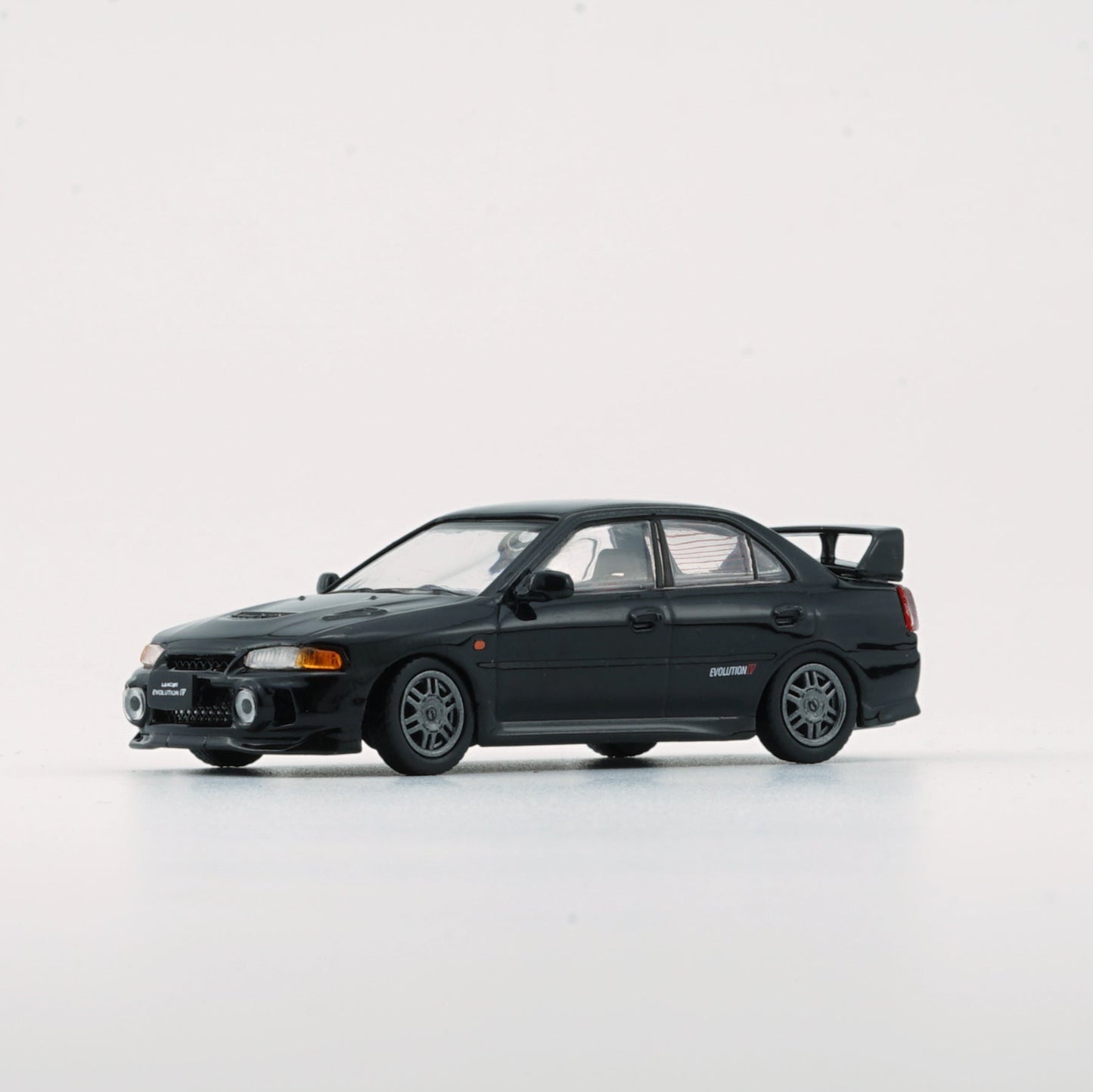 1:64 Mitsubishi Lancer Evolution IV – Black (LHD)