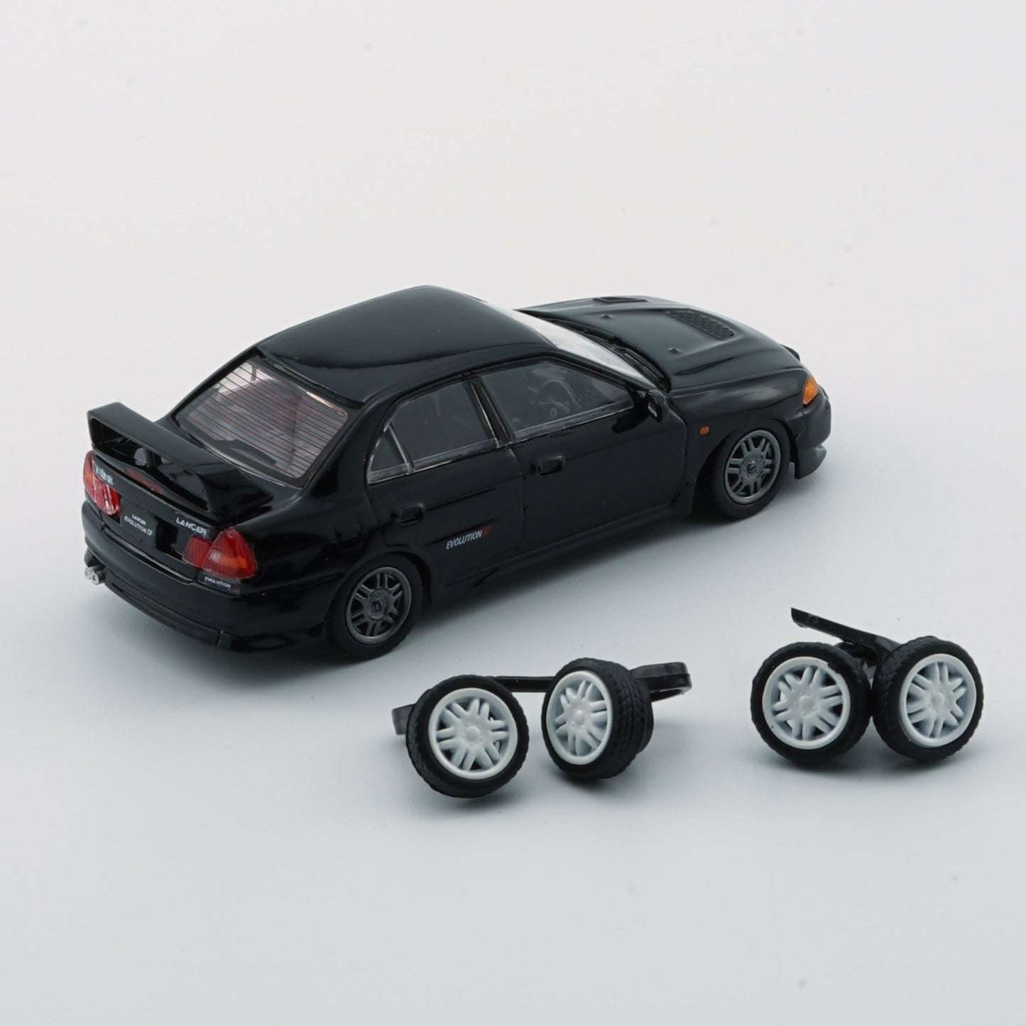 1:64 Mitsubishi Lancer Evolution IV – Black (LHD)