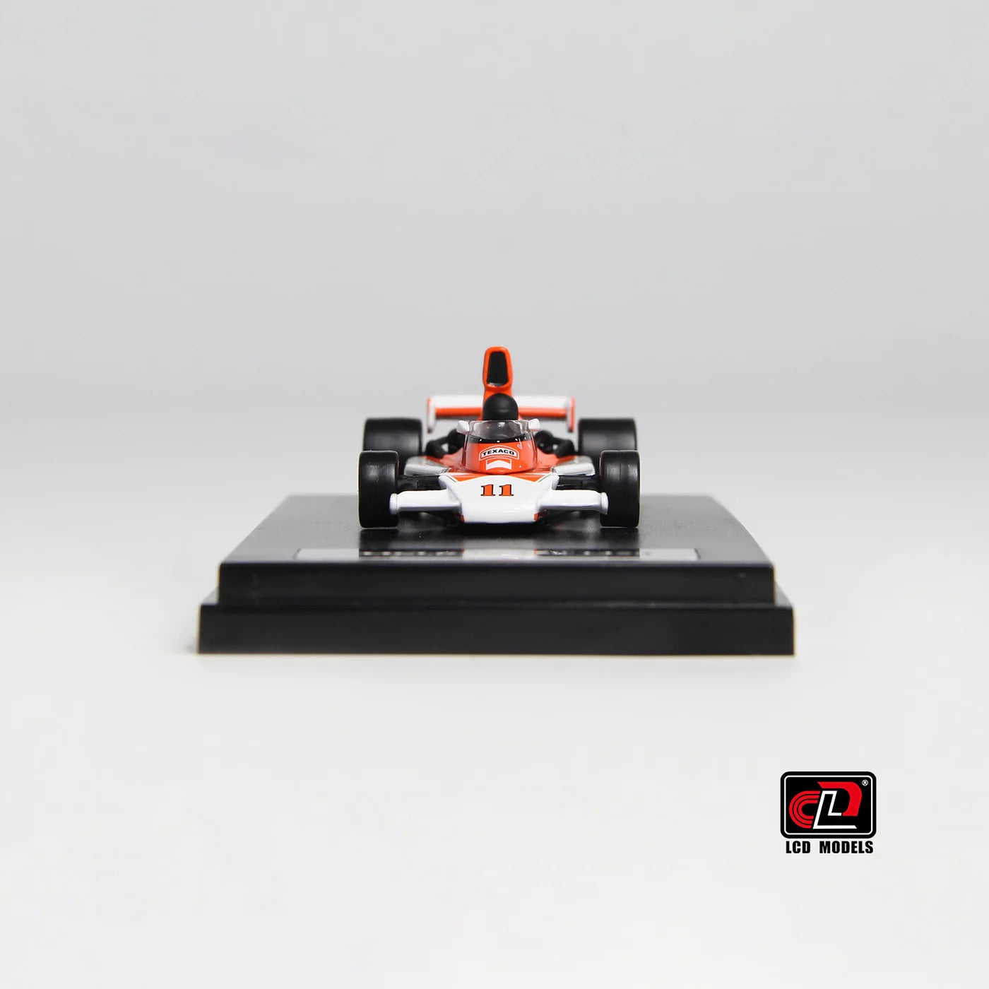 LCD McLaren M23 Orange with White 1:64 Scale Diecast Model